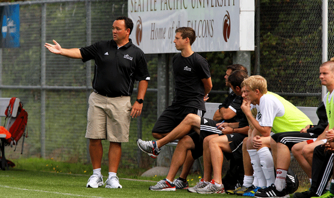 Seattle Pacific head coach Mark Collings (left) has his team just one point out of first place in the GNAC standings, as the Falcons have not lost since their first match of 2013.